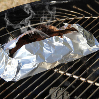 Getting smoke using aluminum foil in a grill